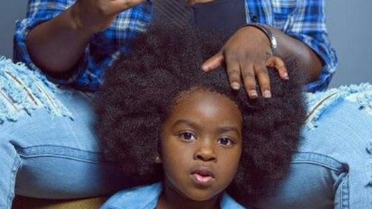 Mother doing son's hair